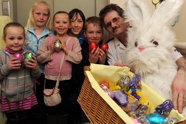 Easter fun at Rufford Care Home, in Gateford Road. The home is visited by the Easter bunny. Pictured is Kim Bown, deputy manager and Tony Hince, care assistant pictured with the Easter bunny handing out chocolate eggs to children visiting the home.