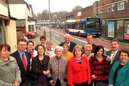 Councillors and petitioners asking for a new bus station, stand outside the bus station on Hardy Street in Worksop in 2009. The Hardy Street bus stops were described as having a "poor waiting environment," with narrow footpaths and limited shelter.