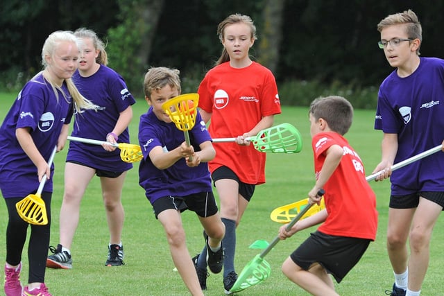 Nottinghamshire School Games. Pop Lacross tournament action between Mansfield's St. Philip Neri (purple) and Worksop's Sparken Hill Academy.