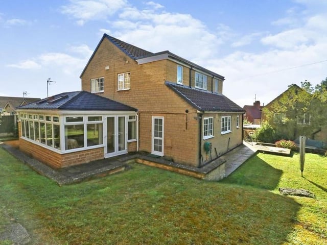 This is another external view of the property from a different angle. As you can see, it stands on a substantial plot.