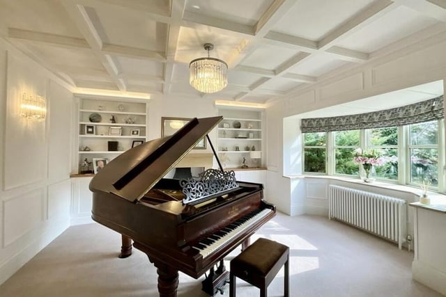 Next to the lounge is this stunning library or music room, which features bespoke cabinetry, offering both functionality and sophistication. It is an excellent entertaining space and features another spectacular, front-facing bay window.