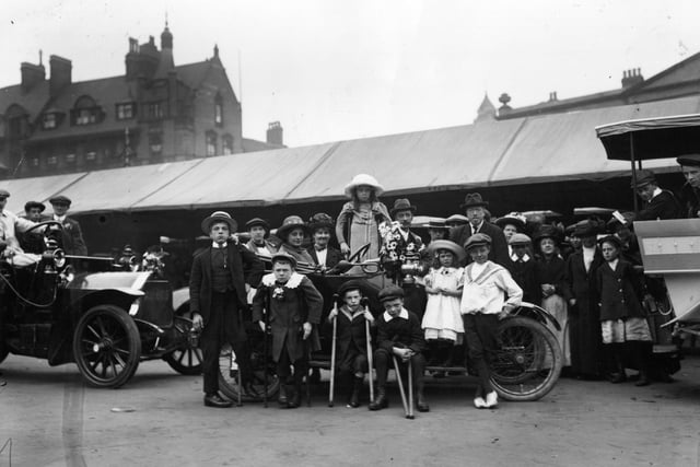 A group of crippled children prepare for a drive to Welbeck Abbey in July 1913.