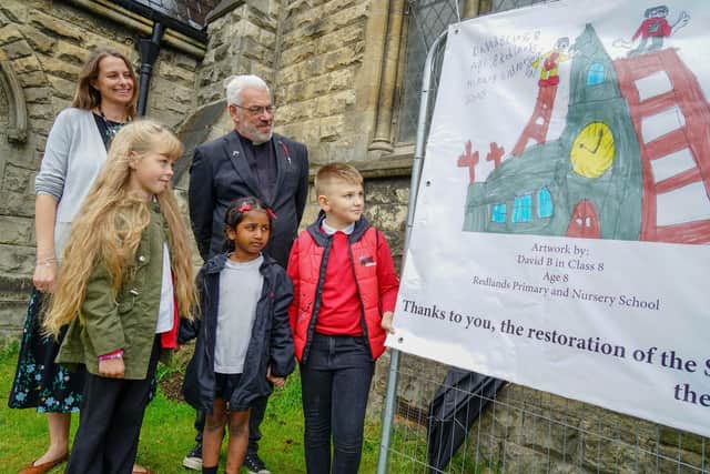 Church banner competition at St John's Church, Worksop Winner from Redland school. Headteacher Gemma Willford, Vicar Tim Stamford, winner and runners up - David, Oliwia and Sruthi.