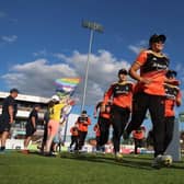 Michaela Kirk leads The Blaze om to the field during the Charlotte Edwards Cup final match between South East Stars and The Blaze in 2024.