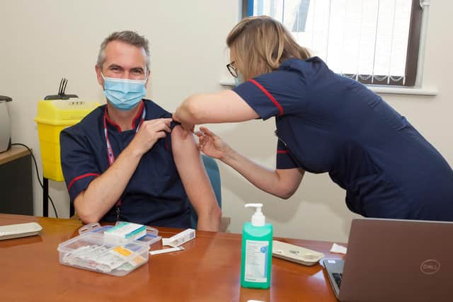 David Purdue receiving his flu jab