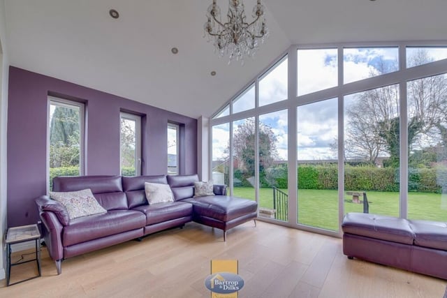 The lounge has been extended to include this stunning sun room with an apex ceiling. It overlooks the garden to three sides with bi-folding doors to one side and three feature windows to another.