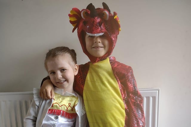 Aliza, aged 3, as Jessie from Toy Story and McKenzie, aged 5, as Dom the Dragon, both from Tuxford