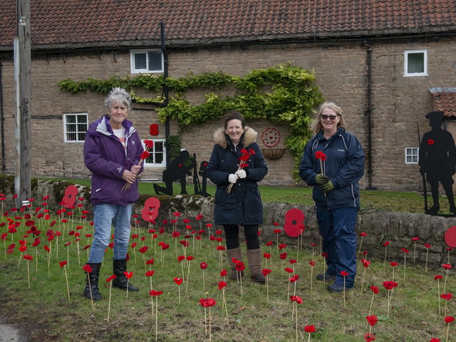 Members of the Warsop Poppy Gang working on the display