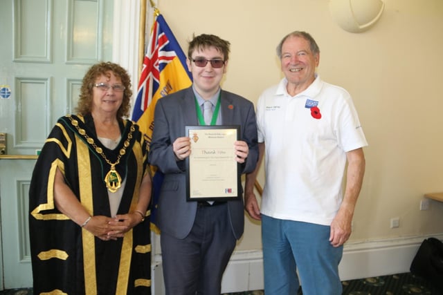 Malachi Carroll, Bassetlaw youth mayor, pictured with council chairman Madelaine Richardson, and David Scott, chair of Worksop RBL branch.
