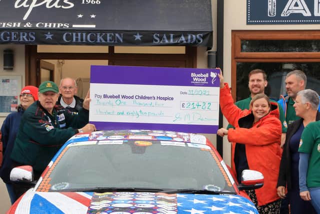 Stuart Dixon and his drivers presenting the money raised from July this year to Bluebell Wood Children's Hospice.