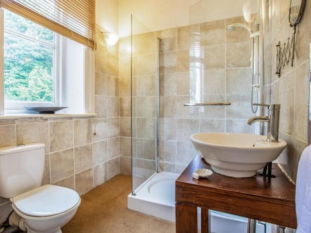 Also at the end of the hallway on the first floor is this separate bathroom, with a shower. Stylish, eh?