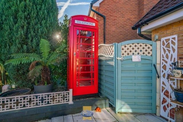 Has Dr Who's Tardis landed? This phone box makes for a quirky feature of the back garden for the current owners of the £310,000 property.