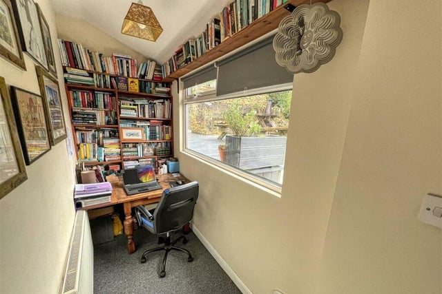 This home office is a quaint space on the ground floor of the £495,000 house. It boasts a fitted carpet, large window and double doors that open out on to the garden. There is even an integrated cat-flap!