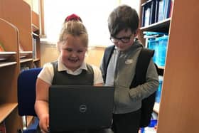Pupils ay Langold Dyscarr Community School with one of the new laptops.