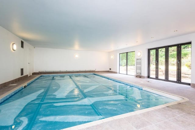 Before we start our tour of the house, let's take a quick peek at the standout feature, that indoor heated swimming pool.