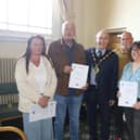 Members of the Worcestershire and Sherwood Foresters Regimental Association receive their certificates.