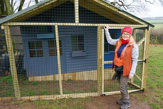 Denise Hardwick with Sid's chalet. Every dog is given a second, third and even fourth chance regardless of their breed or background.