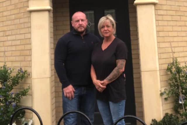 Phil Travis with wife Angie outside their new home on the Dormer Woods estate