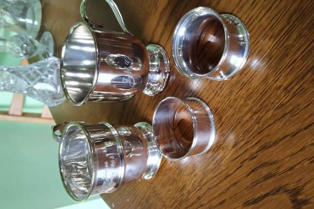 A silver Christening mug was taken by thieves.