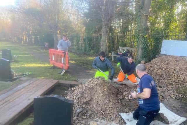 The family took it upon themselves to remove the rubble from the grave, with the help of Parish councillor Graham Coe.