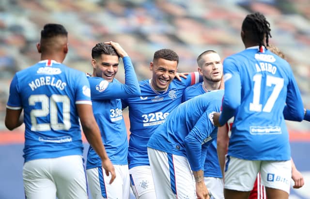 James Tavernier (L) of Rangers celebrates their team's first goal with teammates, an own goal scored by Joe Lewis of Aberdeen. (Photo by Ian MacNicol/Getty Images)