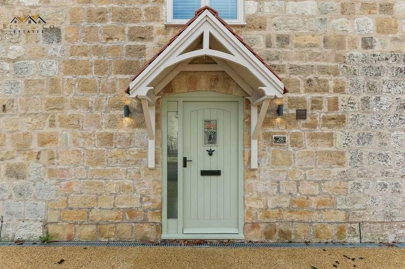 The welcoming and characterful front door to the £450,000 stone barn conversion.
