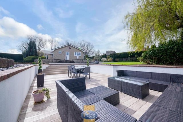 At the side of the £700,000 property is this terrific, sunken entertainment area, complete with seating and even space for a dining table. Ideal for al fresco gatherings in the summer.