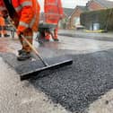 Patching teams test new permanent road replacement methods, and, inset, Coun Neil Clarke.