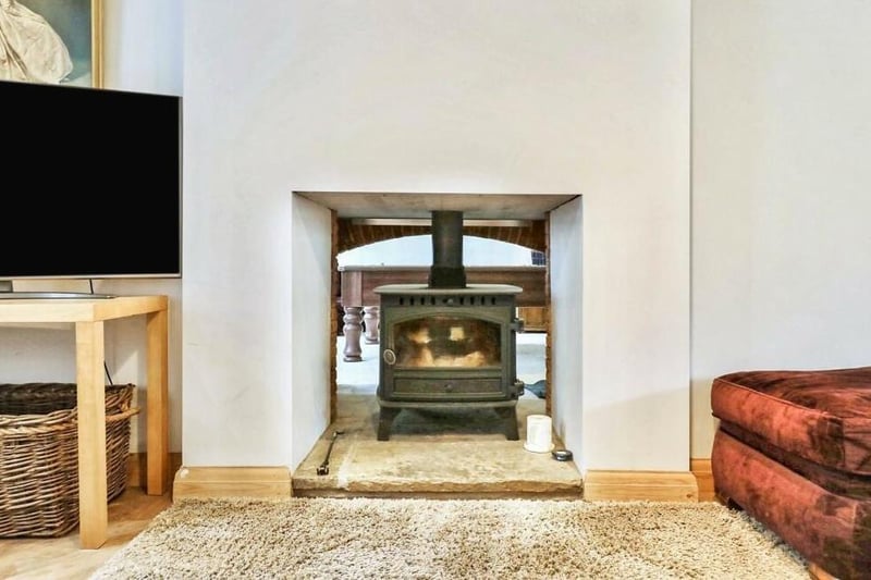This is a close-up of the double-sided fireplace, with multi-fuel stove, in the sitting room. It backs on to the lounge.