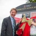Harron Homes' Sales Manager Paul Walters unveiling the Laughton Gate noticeboard with MP Alexander Stafford