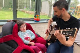 Five-year-old Ella and her dad, Mat, enjoying music at home during lockdown.