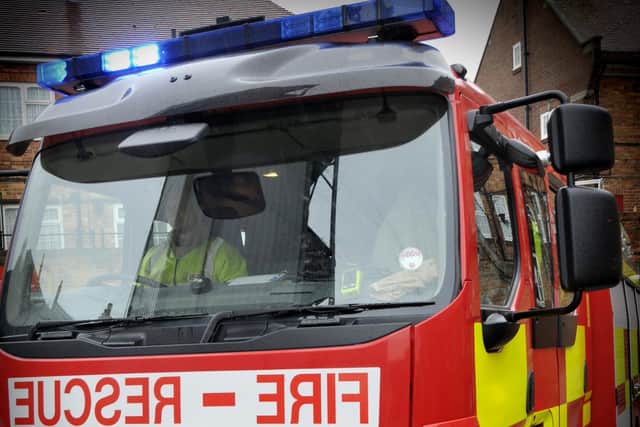 Fire engine and fire service officers. Picture Richard Ponter