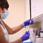 A health worker prepares a dose of the Pfizer/BioNTech Covid-19 vaccine (Photo by DANIEL LEAL-OLIVAS/AFP via Getty Images)