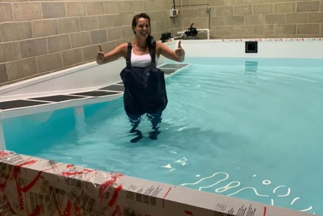 Helen Shipman testing out her new pet hydrotherapy pool at the centre