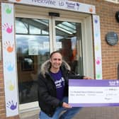 Megan Walker-O’Brien handing over the cheque to Bluebell Wood’s Regional Fundraiser, Jason Gossop