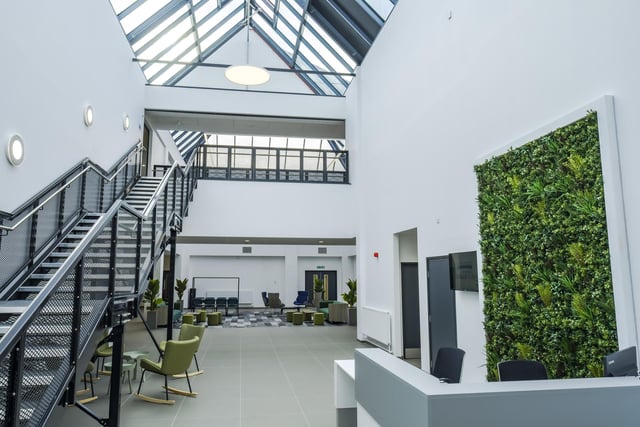 The entrance way and reception area. The building is set over two stories with a huge roof lantern.