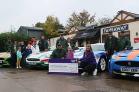 Stuart Dixon of Sherwood Jaguars makes a donation of £59,456.78 to Ruth Wallbank of Bluebell Wood. The group's total fundraising for the hospice now totals over £250,000