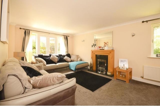 Like all rooms in the £500,000 home, the lounge is so well appointed. Settle down on one of the sofas and relax.