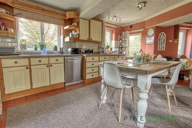 The kitchen has plenty of space for free-standing appliances and also a breakfast table. The country feel is finished by a terracotta-coloured, tiled floor, while two windows overlook the back garden and a uPVC door gives access to it.