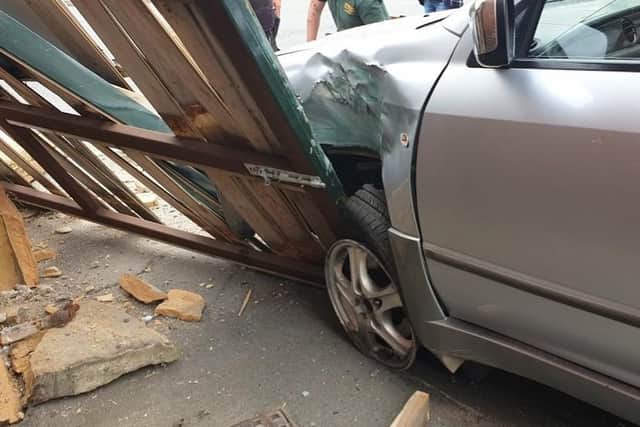 The car crashed into a fence outside the Boot and Shoe pub.