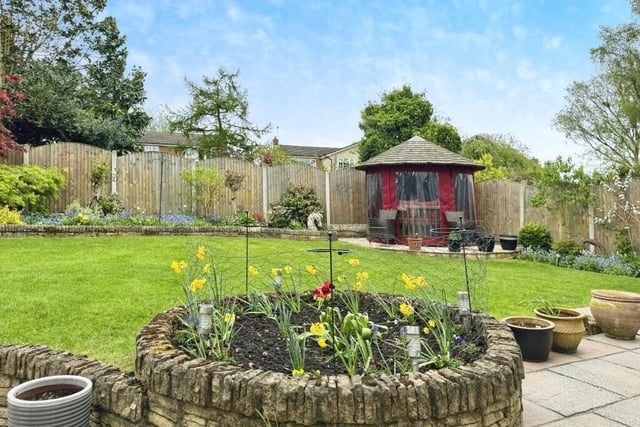 The rear garden is mainly laid to lawn, but an exquisite feature is this circular summer house, where you can sit and enjoy the peaceful setting, come rain or shine.