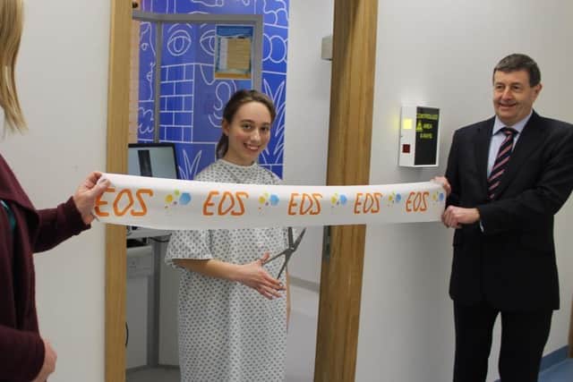 Worksop College student Philippa Walker opening the EOS scanner at Sheffield Children's Hospital.
