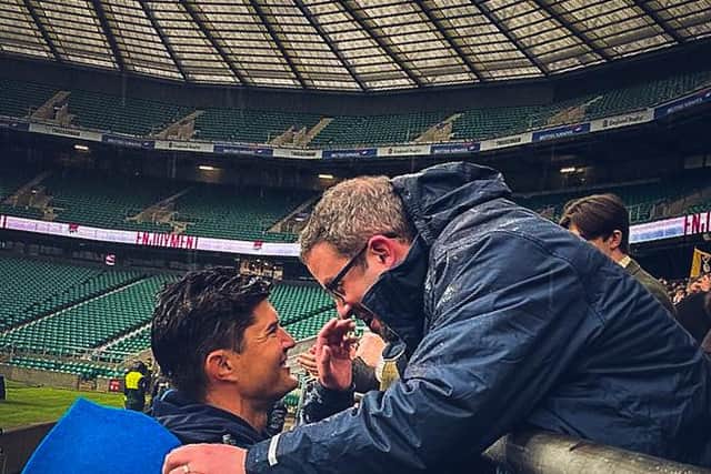 Headteacher Dan Wright shakes hands with head coach Dylan Campbell after victory at Twickenham.