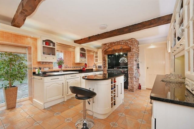 One of the breakfast kitchen's biggest assets is a new Rangemaster oven. Note also the ceiling beams, which add to the character of the property.