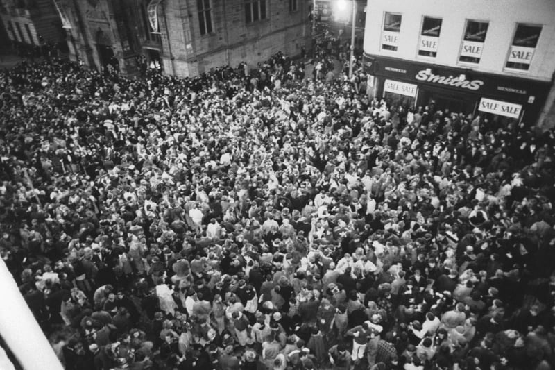 Thousands of people at the Tron church in the Royal Mile to bring in the New Year on Hogmanay, December 1991.