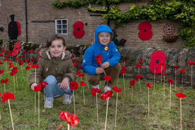 Pictured are Layla Martin, six and Bradley Martin, eight helping with the poppy display