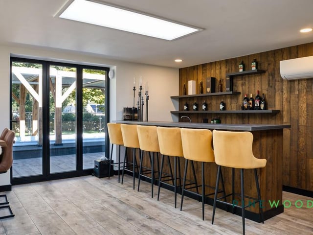 The fitted bar within an area geared for entertaining.