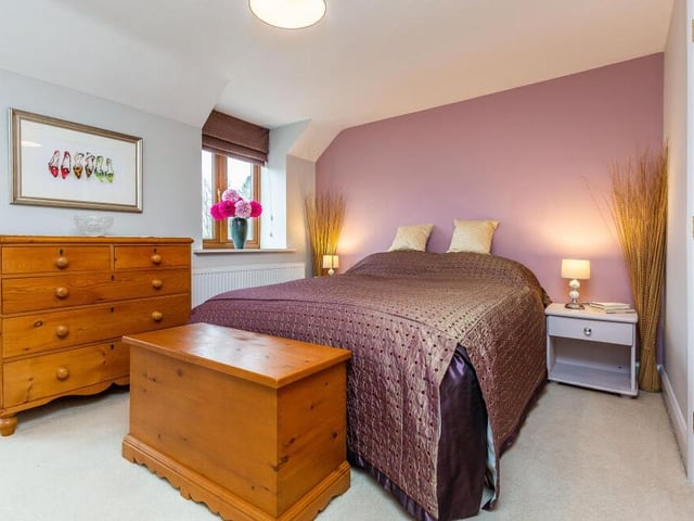 This double bedroom on the first floor radiates warmth.