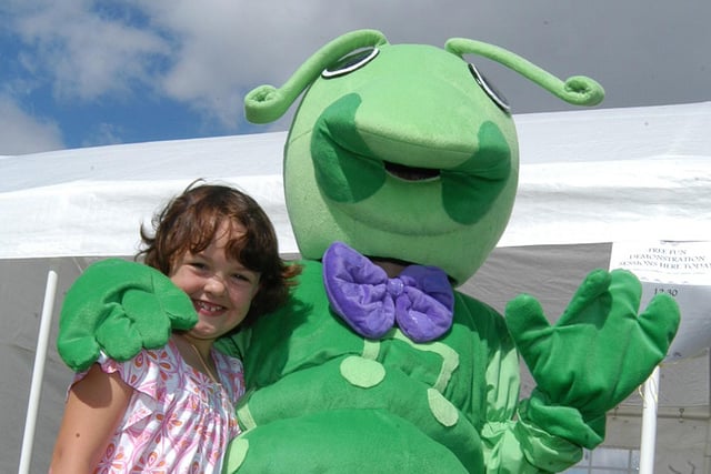 Kilton Showground, Worksop. Worksop Festival. Pictured at the time, (then): Natasha Rodgers (7) with a friendly caterpillar, in the costume is Alison Nobble of Caterpillar Music, at Gateford.