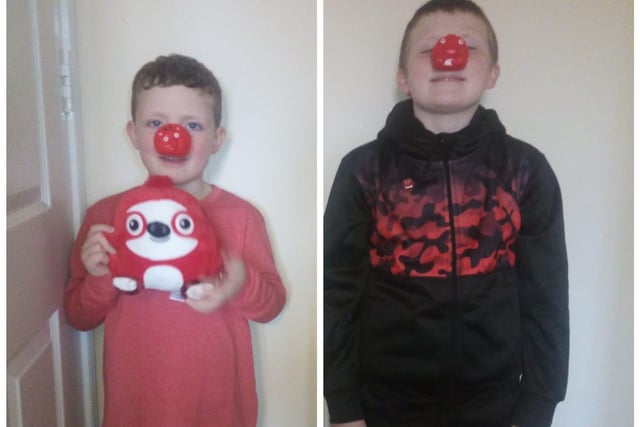 These two brothers, Harry, six, and Tom, aged nine, wore their red noses with pride.